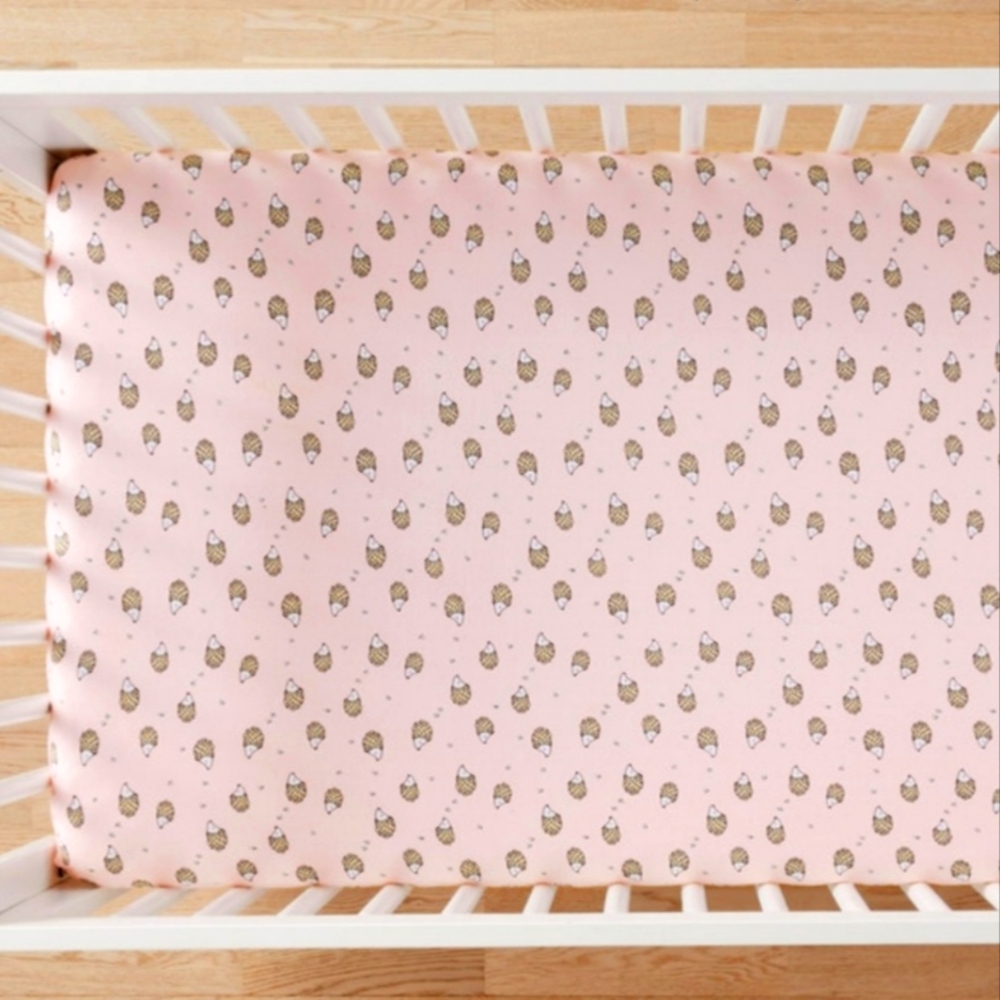 Hanna Andersson pink with hedgehog print crib sheet